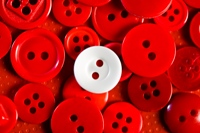 Everyone wants to fit in, but we are called to stand out (illustrated by buttons)